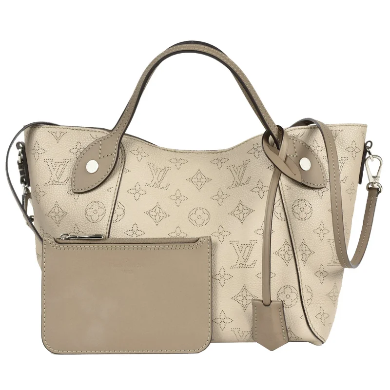 Louis Vuitton Twist bags with a snakeskin - effect panel for a bold lookLOUIS VUITTON Hina Tote