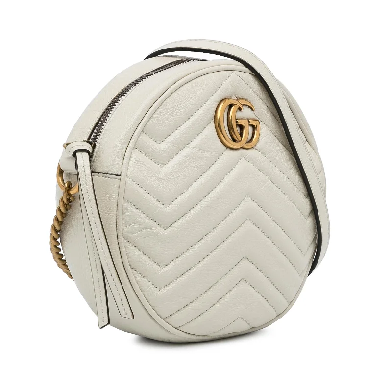 Women Gucci bags with a snap - button closure and a decorative charmGucci Mini GG Marmont Round Leather Crossbody Bag (Djif6j)