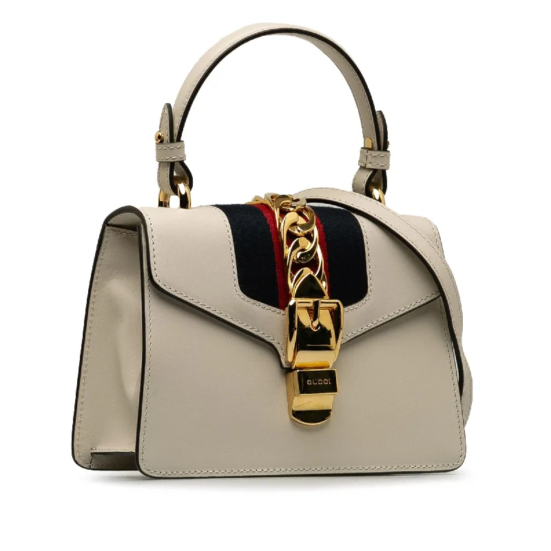 Gucci tote bags for women with a double - handle designGucci Mini Sylvie Satchel OYDvet)